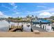 A waterfront home with a dock and boat lift, offering access to the canal and waterfront living at 4252 Floramar Ter, New Port Richey, FL 34652