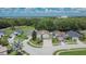 An aerial view of the property showcasing its prime location within a well-maintained community, near green spaces and local amenities at 4634 Mapletree Loop, Wesley Chapel, FL 33544