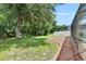 Secluded backyard with mature trees at 4634 Mapletree Loop, Wesley Chapel, FL 33544
