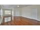 Spacious bedroom with hardwood floors, a ceiling fan, and double closets at 4634 Mapletree Loop, Wesley Chapel, FL 33544
