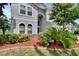 Inviting home with well-maintained landscaping and a mix of greenery and mulch at 4634 Mapletree Loop, Wesley Chapel, FL 33544