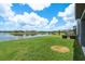 Enjoy picturesque lake views from this home's grassy backyard at 4644 San Martino Dr, Wesley Chapel, FL 33543
