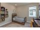 This bedroom features a twin bed, neutral-colored walls, a window, and a desk area at 4644 San Martino Dr, Wesley Chapel, FL 33543