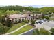 Aerial shot of community clubhouse featuring beautiful architecture and lush landscaping at 4644 San Martino Dr, Wesley Chapel, FL 33543