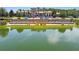 The Club at Estancia features a beautiful pond and manicured landscaping in a tranquil setting at 4644 San Martino Dr, Wesley Chapel, FL 33543