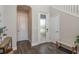 Bright entryway with stylish flooring, frosted glass door, and convenient bench seating at 4644 San Martino Dr, Wesley Chapel, FL 33543