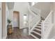 Welcoming entryway with staircase, stylish flooring, and plenty of natural light at 4644 San Martino Dr, Wesley Chapel, FL 33543