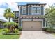 Beautiful two-story home with a two-car garage, elegant landscaping, and inviting curb appeal at 4644 San Martino Dr, Wesley Chapel, FL 33543