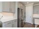 The spacious kitchen features stainless steel appliances, modern cabinets, a stylish backsplash, and ample counter space at 4644 San Martino Dr, Wesley Chapel, FL 33543