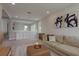 Neutral living room with large sofa, stylish decor and an open floorplan at 4644 San Martino Dr, Wesley Chapel, FL 33543