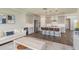 Open-concept living space featuring a living area, a kitchen island, and a harmonious blend of modern design and comfort at 4644 San Martino Dr, Wesley Chapel, FL 33543