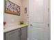 Well-organized mudroom with custom cabinets, quartz countertops, and convenient storage solutions at 4644 San Martino Dr, Wesley Chapel, FL 33543