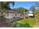 Backyard features lush landscaping and a well-maintained lawn at 4708 W Neptune St, Tampa, FL 33629