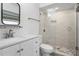 Bathroom with glass enclosed shower, modern fixtures, and decorative tiling at 4708 W Neptune St, Tampa, FL 33629