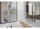 Elegant powder room with floating vanity, modern faucet and decorative mirror at 4708 W Neptune St, Tampa, FL 33629