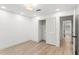 Bedroom features a closet with sliding doors and wood flooring, offering ample storage at 4708 W Neptune St, Tampa, FL 33629