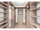 Walk-in closet with custom shelving and ample storage space at 4708 W Neptune St, Tampa, FL 33629
