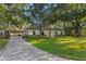 Charming single-story home with a brick driveway and ample parking at 4708 W Neptune St, Tampa, FL 33629