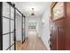 Inviting foyer featuring hardwood floors and modern lighting at 4708 W Neptune St, Tampa, FL 33629