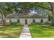 Charming single-story home with lush lawn and mature trees at 4708 W Neptune St, Tampa, FL 33629