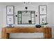 Hallway with unique wooden console table and decorative mirror at 4708 W Neptune St, Tampa, FL 33629