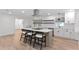 Open concept kitchen with white counter tops, stainless appliances, and bar seating at 4708 W Neptune St, Tampa, FL 33629