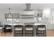 Modern kitchen with white cabinets, subway tile backsplash, and stainless appliances at 4708 W Neptune St, Tampa, FL 33629