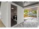Exterior view of laundry room featuring modern washer and dryer at 4708 W Neptune St, Tampa, FL 33629