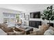 Bright and airy living room with lots of natural light and a large sectional couch at 4708 W Neptune St, Tampa, FL 33629