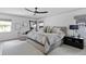 Large main bedroom with ceiling fan, neutral decor, and ample natural light at 4708 W Neptune St, Tampa, FL 33629