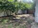 This backyard features a white fence and a wood fence for privacy at 4721 W Wallace Ave, Tampa, FL 33611