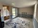 Spacious empty room with a nice area rug and lots of natural light at 4721 W Wallace Ave, Tampa, FL 33611