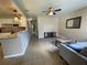 Open living room with tiled flooring and view into the updated kitchen at 4721 W Wallace Ave, Tampa, FL 33611