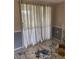 This living room features nice curtains, neutral paint, and a modern-style rug at 4721 W Wallace Ave, Tampa, FL 33611