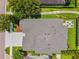 Aerial shot of a home's roof, driveway, and backyard with an inviting fire pit area and seating at 6007 Quartz Lake Way, Lithia, FL 33547
