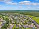 Panoramic aerial view of a well-planned community with lush greenery and picturesque homes at 6007 Quartz Lake Way, Lithia, FL 33547