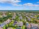 Overhead shot of a community, highlighting homes with solar panels and private pools at 6007 Quartz Lake Way, Lithia, FL 33547