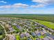 High-angle view of a residential neighborhood showcasing well-maintained homes and verdant landscaping at 6007 Quartz Lake Way, Lithia, FL 33547