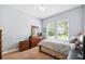 Bedroom features carpet, a window, light blue walls and wooden furnishings at 6007 Quartz Lake Way, Lithia, FL 33547