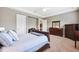 Spacious Primary bedroom featuring neutral walls and carpet, plus wood furniture at 6007 Quartz Lake Way, Lithia, FL 33547