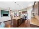 Kitchen with granite counters, a spacious island, and stainless steel appliances at 6007 Quartz Lake Way, Lithia, FL 33547