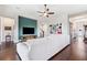 A modern living room with media center, hardwood floors, and neutral decor at 6007 Quartz Lake Way, Lithia, FL 33547
