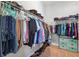 Walk-in closet with wire shelving, ample storage space, and neatly arranged clothing and shoes at 6007 Quartz Lake Way, Lithia, FL 33547