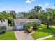 An aerial view of a well-kept home with a brick driveway and manicured lawn at 605 Bosphorous Ave, Tampa, FL 33606