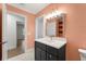 Modern bathroom boasts stylish vanity, decorative floor tiling, and is brightly lit with natural light at 605 Bosphorous Ave, Tampa, FL 33606