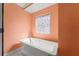 Modern bathtub under a colorful window with mosaic glass at 605 Bosphorous Ave, Tampa, FL 33606