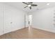 Spacious bedroom with a ceiling fan, two entry doors, and a built in closet space for storage at 605 Bosphorous Ave, Tampa, FL 33606