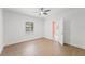 Bright bedroom has tiled floors and a window overlooking the exterior of the home and the bathroom at 605 Bosphorous Ave, Tampa, FL 33606
