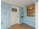 Covered porch with a front door, a new mailbox, and an exterior light at 605 Bosphorous Ave, Tampa, FL 33606