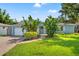Charming one-story home with a well-manicured lawn and landscaping at 605 Bosphorous Ave, Tampa, FL 33606